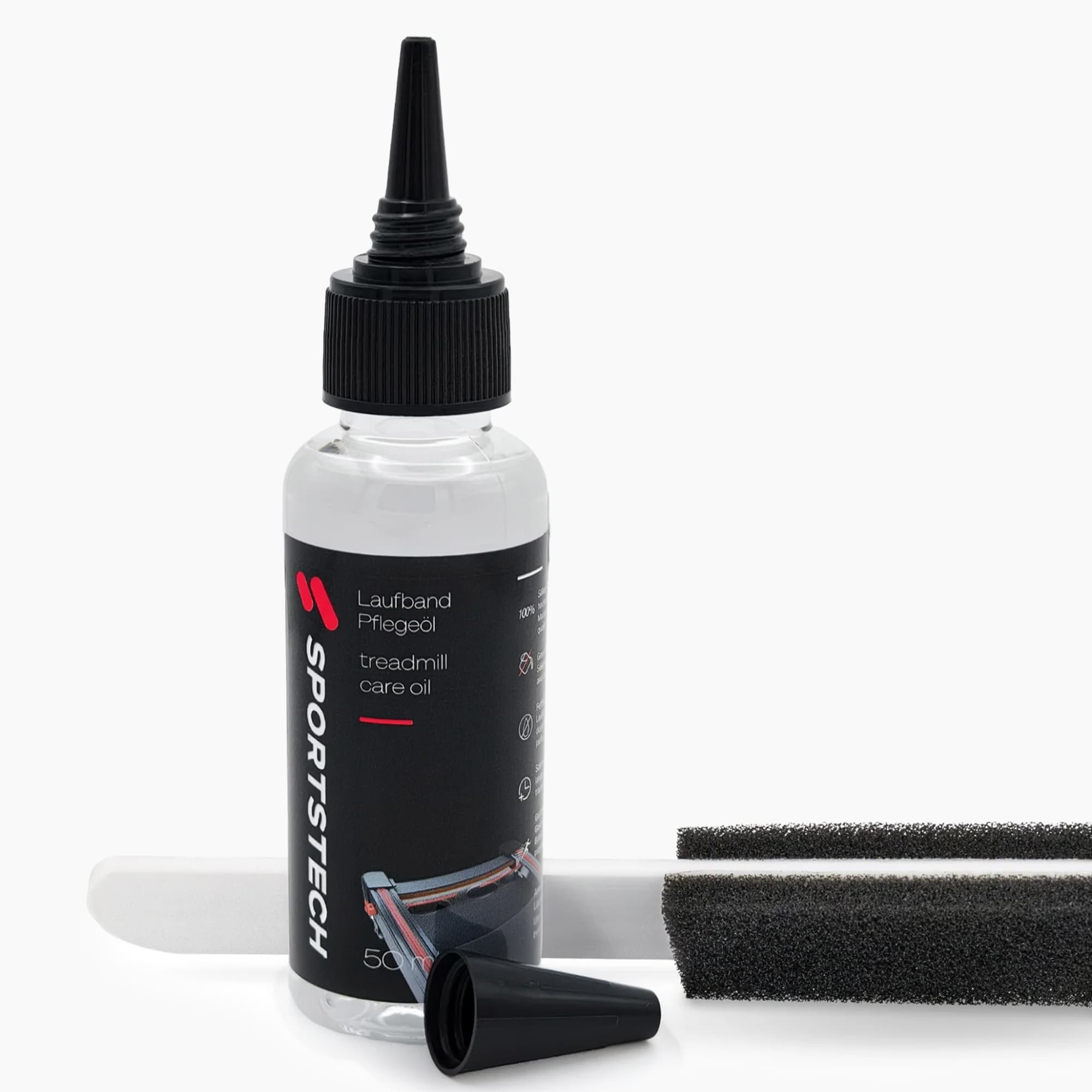 50-ml-Flasche Laufband-Pflegeöl mit Spitztülle neben Applikatorstab und zwei Schaumstoffaufsätzen
