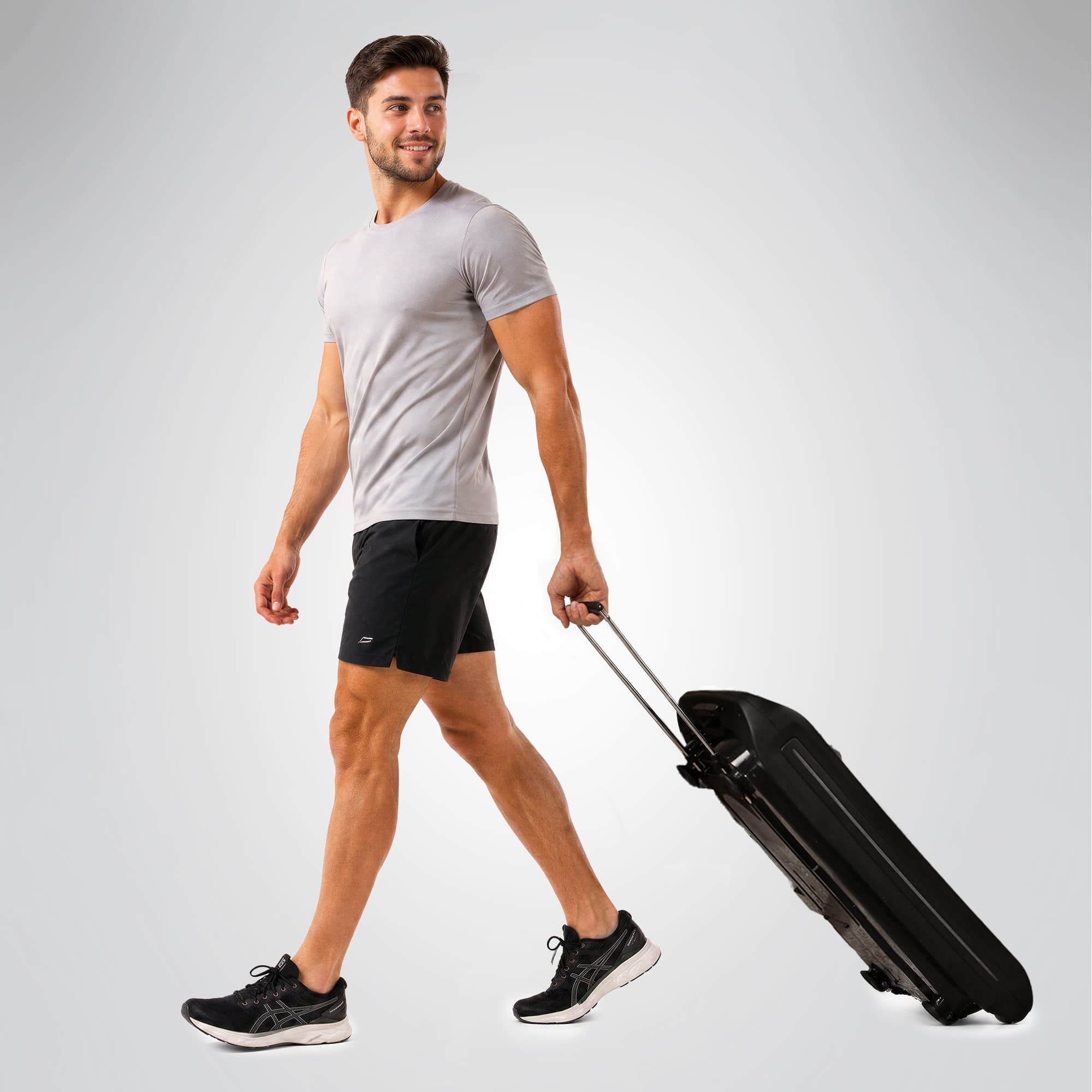 Mann zieht die zusammengeklappte sVibe Vibrationsplatte wie einen Trolley am ausziehbaren Griff