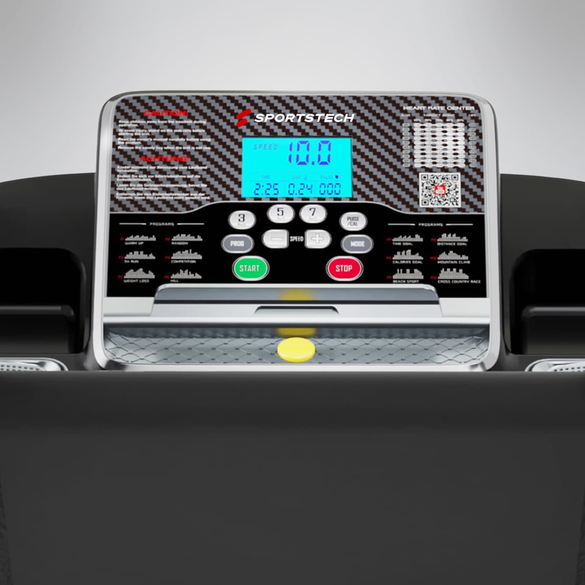 Nahaufnahme der F10-Konsole mit blauem LCD-Display, Start/Stopp-Tasten und Trainingsprogrammen