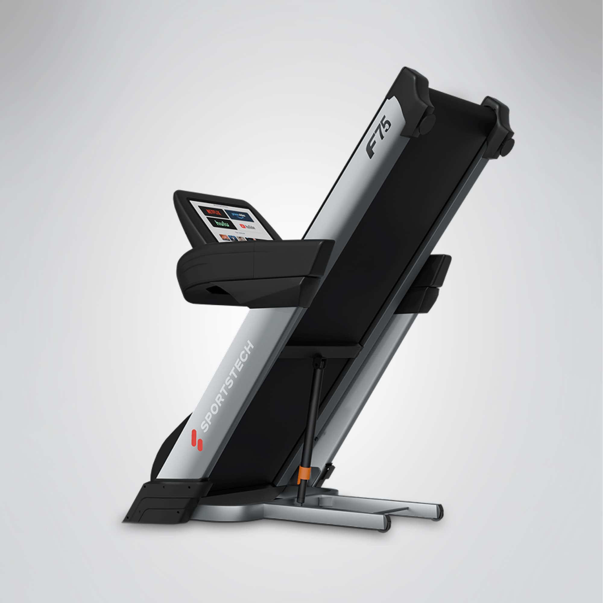 F75 Profi-Laufband seitlich hochgeklappt, Klappmechanismus mit Zylinder und Display sichtbar