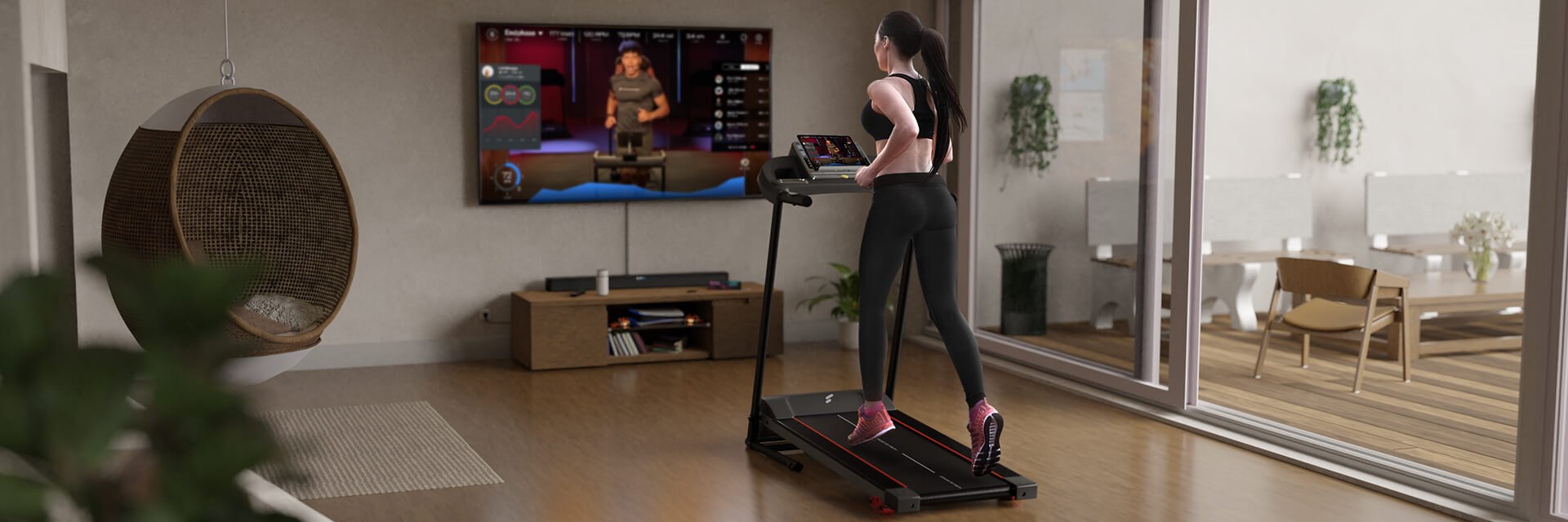 Frau in Sportkleidung läuft auf schwarzem Laufband F10, TV im Hintergrund